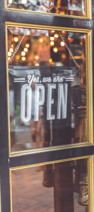 closeup-photo-black-door-yes-we-are-open-signage-929245